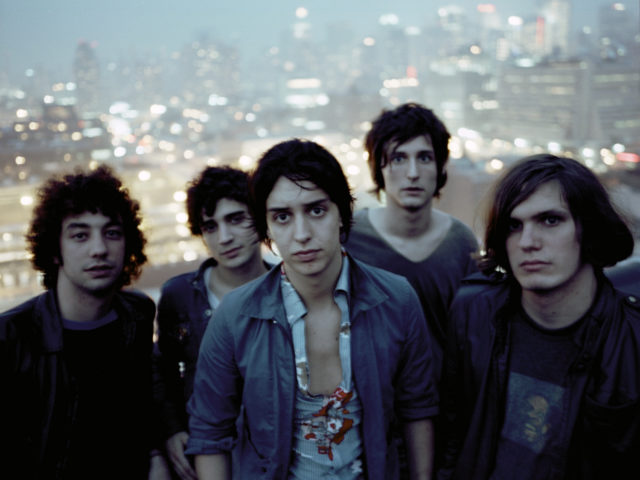 The band The Strokes look at the camera